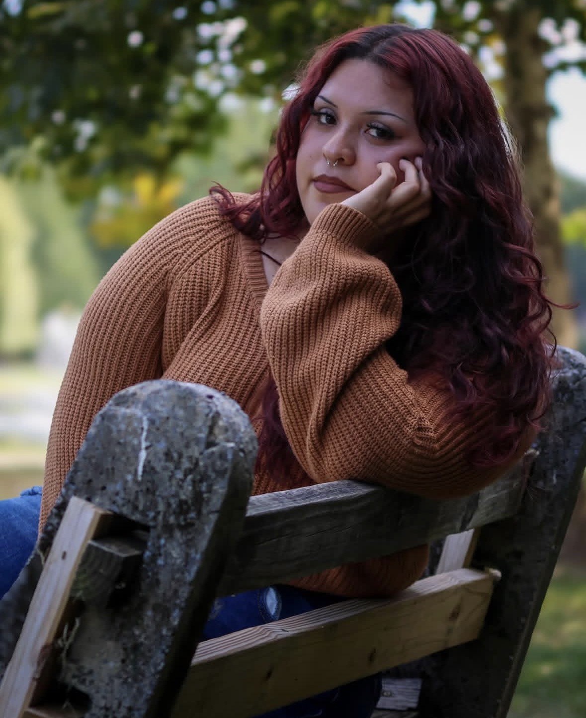 Outdoor seated portrait with warm autumn tones