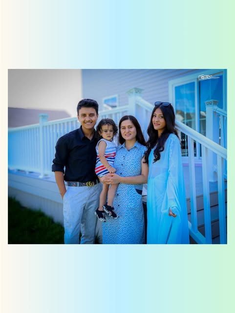 Family portrait outside a home