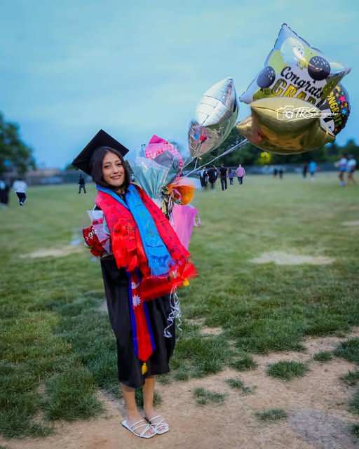 Graduation portrait with celebration balloons